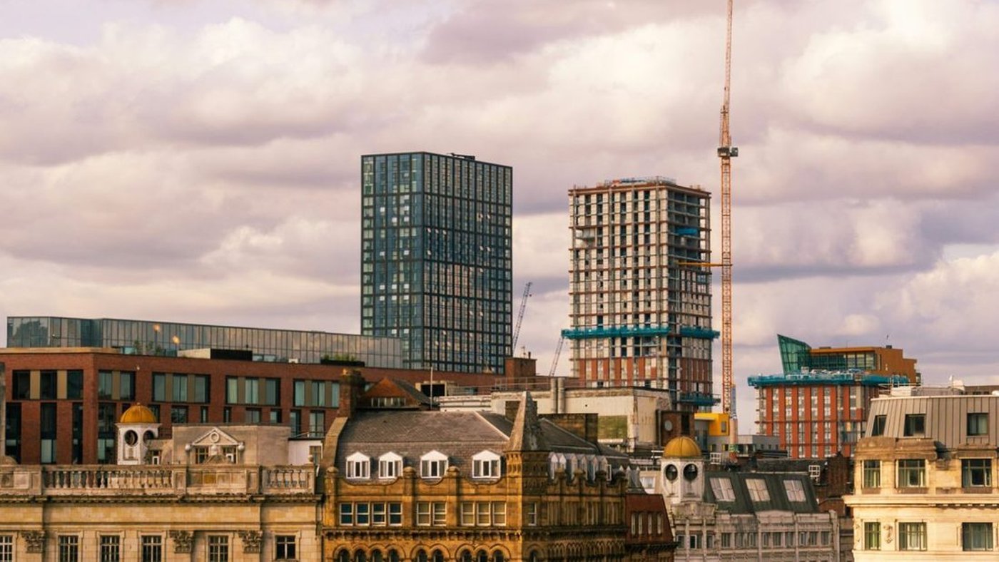 Manchester towers under a bright sky