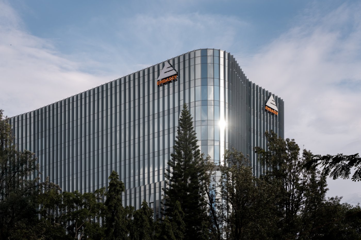 Single identity, Bangalore. Fisher argued the building needed no front, back or side because of its prominence; the whole of it has since been leased to Apple.