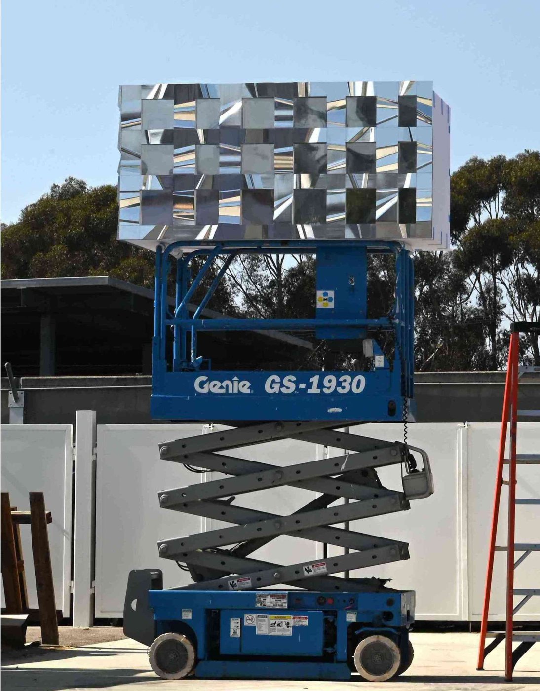 A full-size panel, in paper. Built in the office car park and viewed from ten feet, from further back and from down the street, to check the articulation did what the drawings claimed.