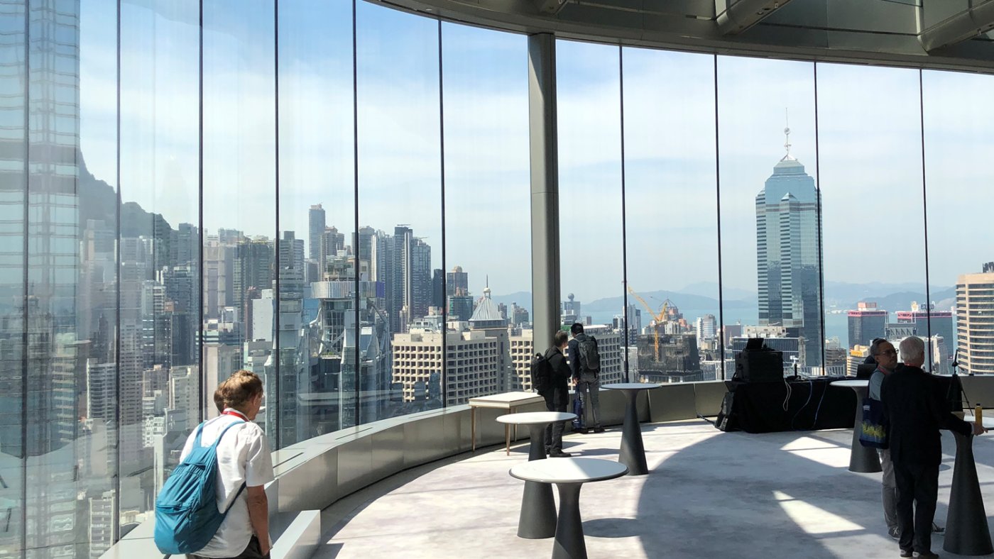 Six layers, and no distortion. The vertical wall at the banquet hall is structural glass with nothing behind it, six plies of 12 mm fully toughened glass bonded with five structural interlayers.