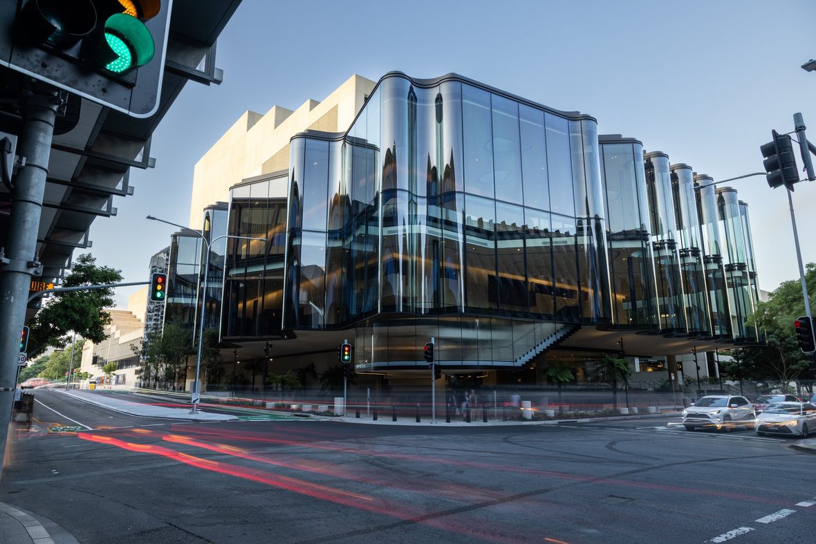 Faceted glass-and-aluminium façade at a street corner of Harborside
