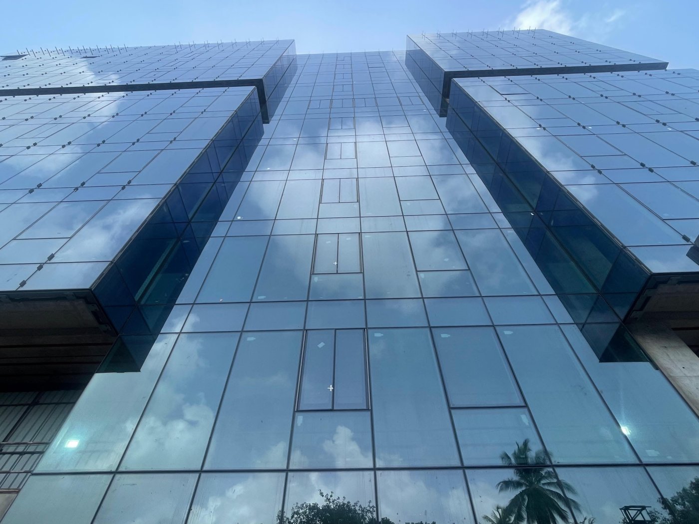 Fins carrying the light. Patki explained that lighting was integrated into the fins and thrown away from the glass, because a glass building cannot itself be lit.