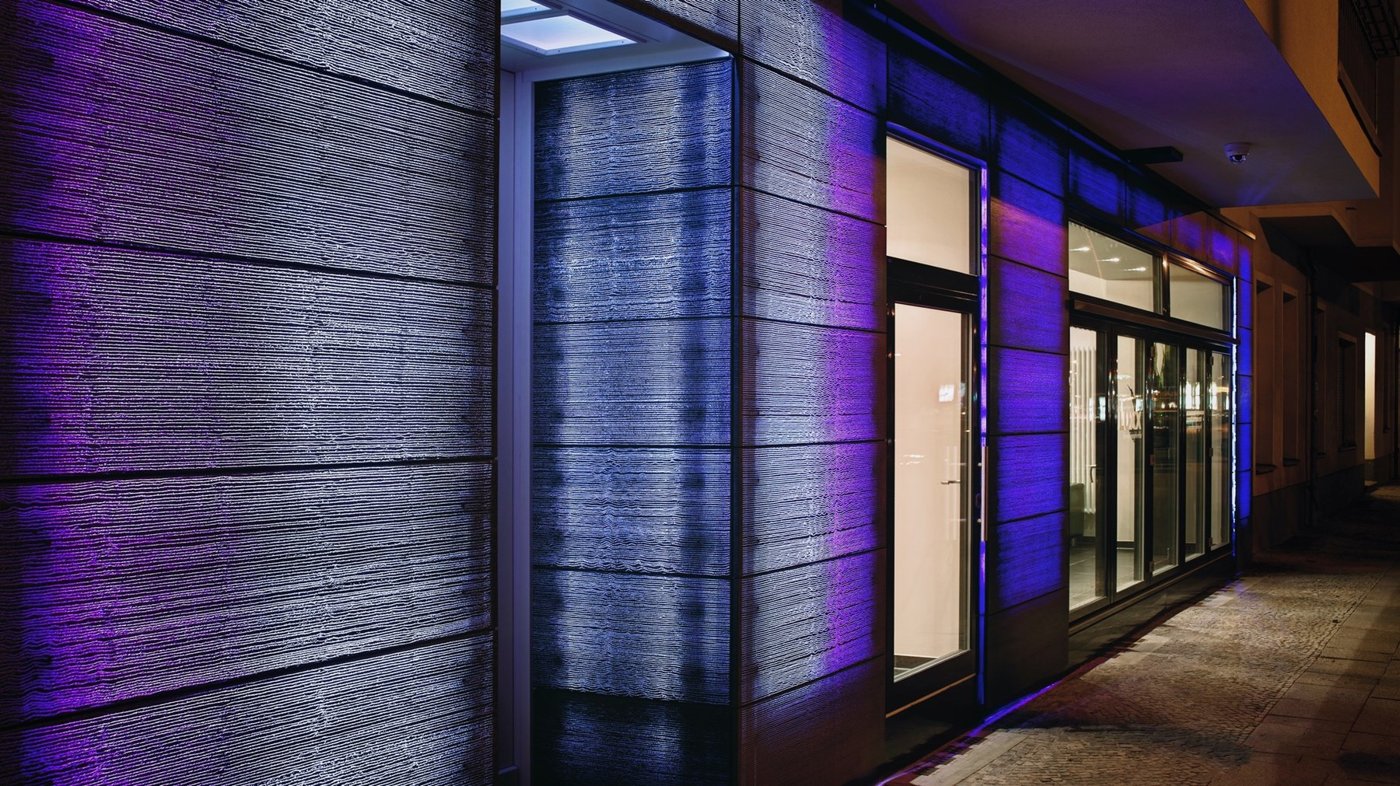 Light-transmitting concrete façade with changing colour