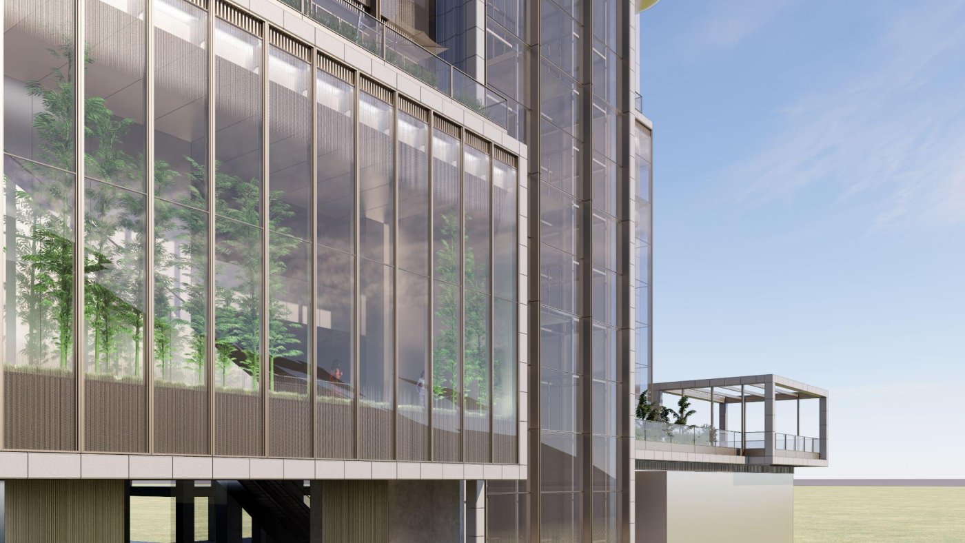 Glazed terracotta, and a bronze stick system. The palette was chosen for low embodied carbon, with a green wall and granite alongside, and the terracotta broken into pieces to stay inside the allowable façade zone.