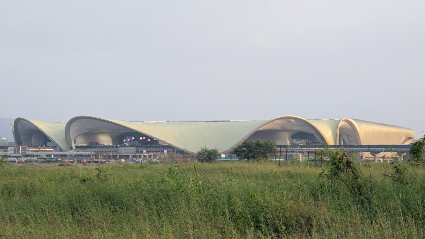 Navi Mumbai International Airport. The lotus-inspired roof floats above the mega columns, with phases one and two, sized for 20 million passengers, inaugurated two days before Shah spoke.