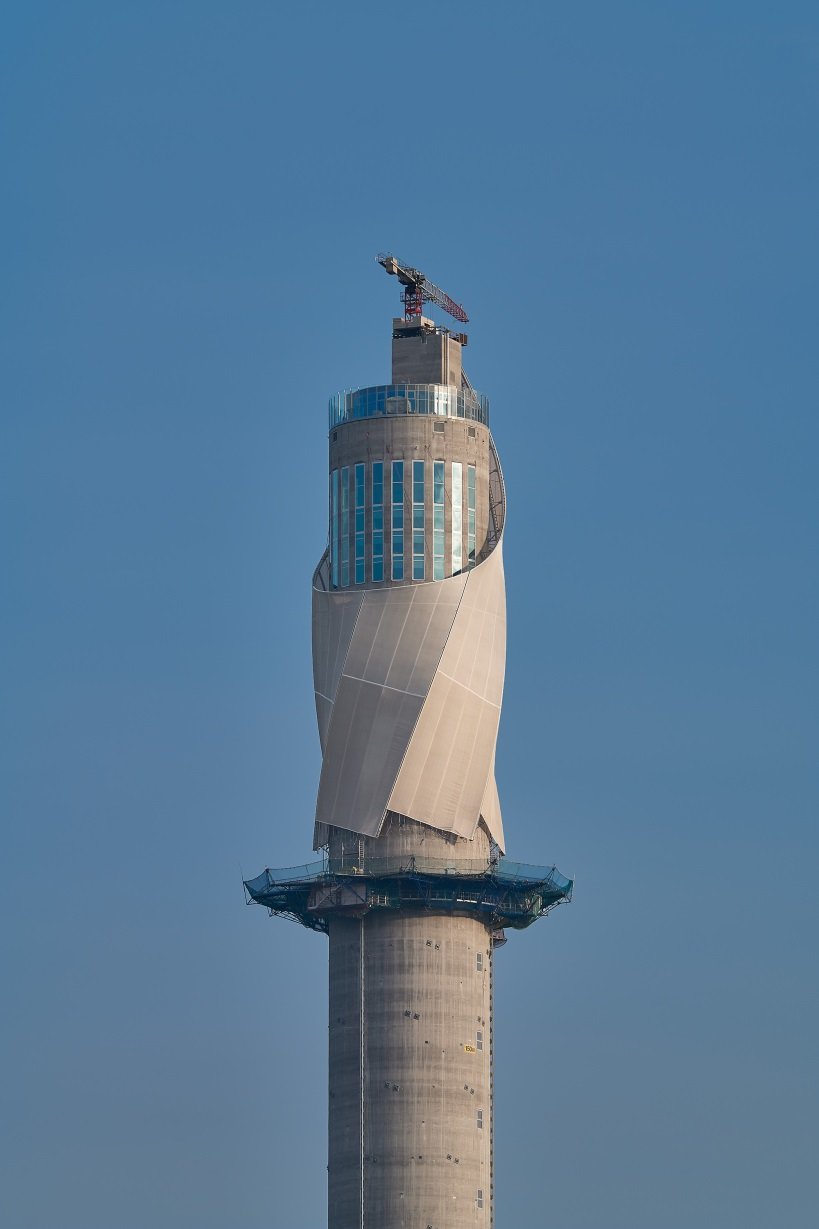 A helix to the top. Running it up a very slender tower controls the other effects wind brings, Alkan said, on a shaft already deflecting some 50 centimetres.