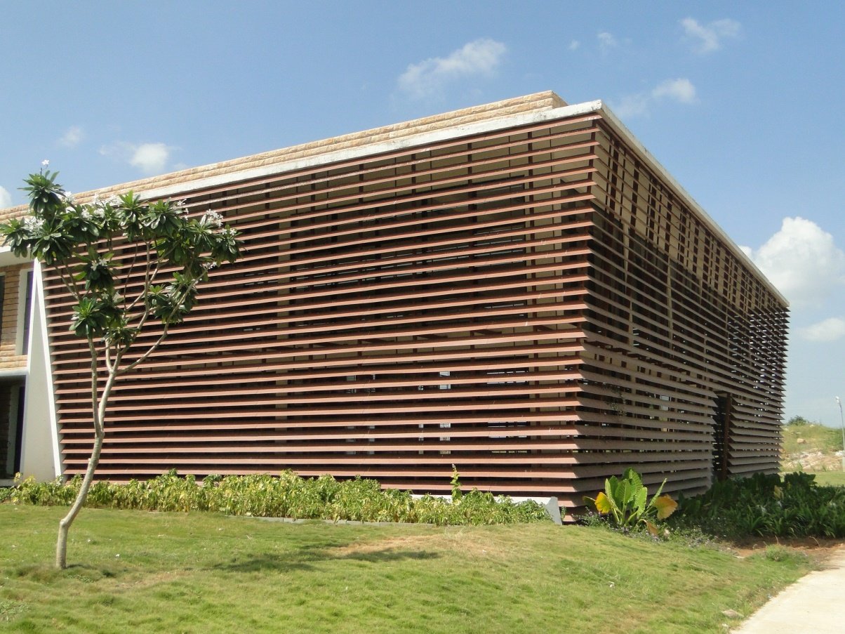 Raichur college. Horizontal louvres angled from sun path analysis, cutting excess glare and giving occupants visual and thermal comfort.