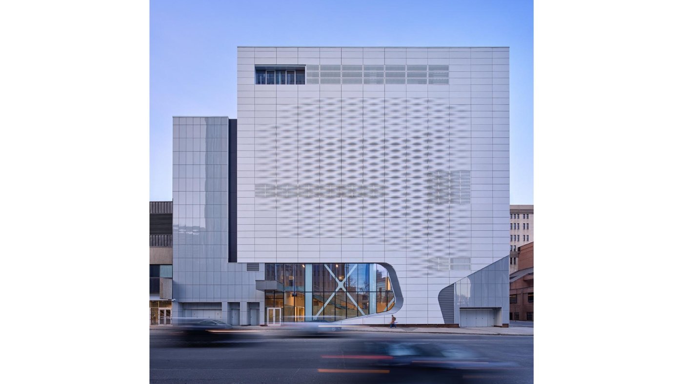 The completed Glenbow façade of undulating concrete and perforated metal panels
