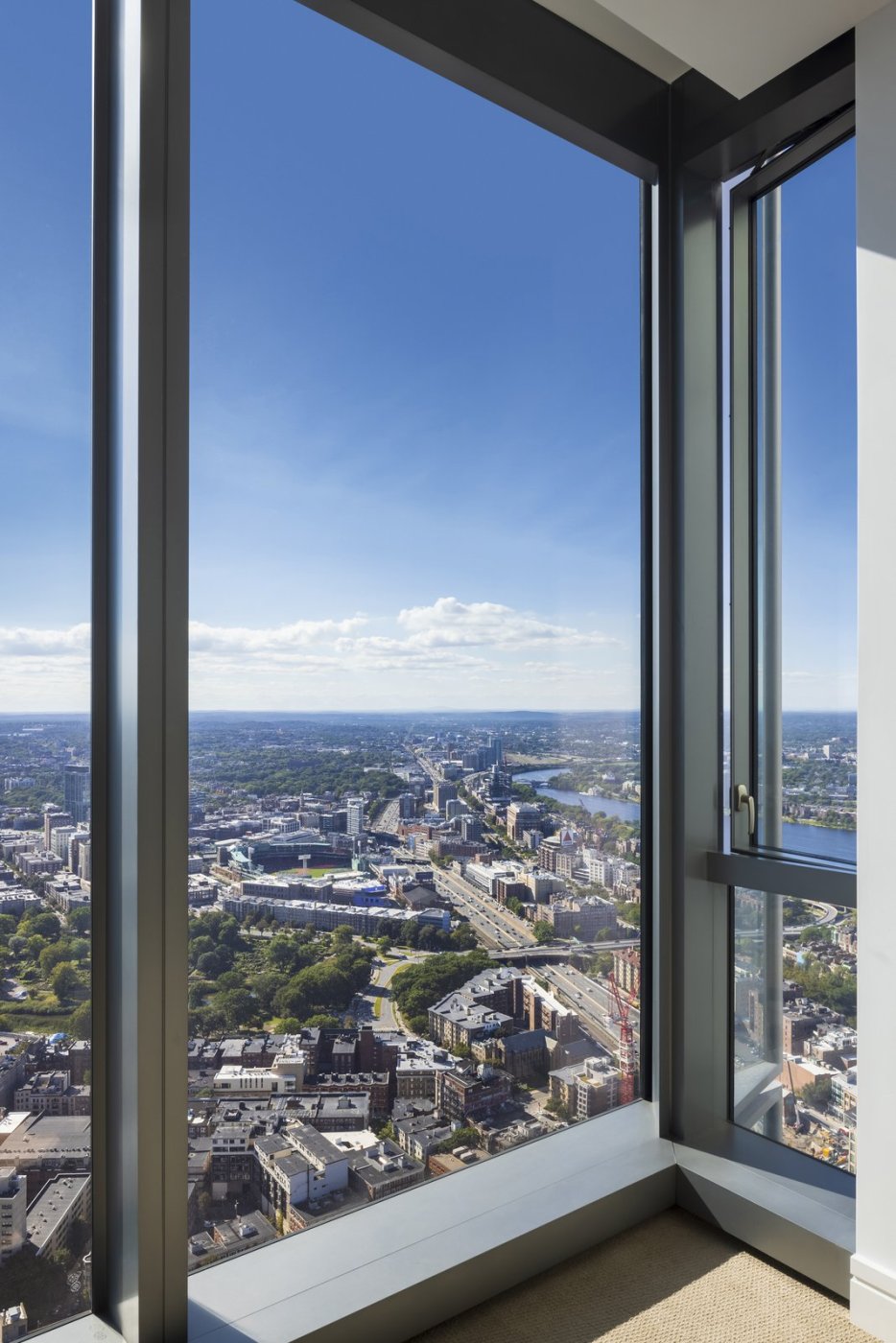 Two views out. Arianpour cited Harry Cobb's rule that a residential room needs them, and said the finished building achieved it.