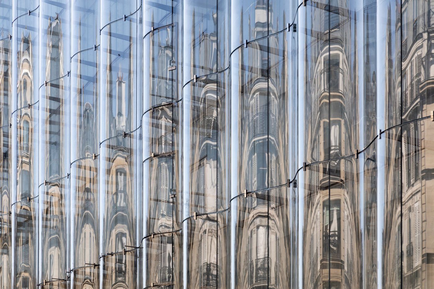Close view of La Samaritaine's curved glass geometry
