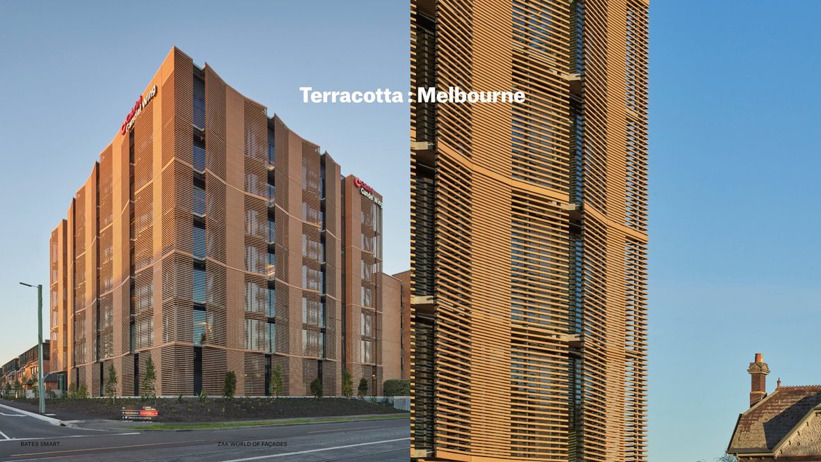 A building with a pleated terracotta batten façade