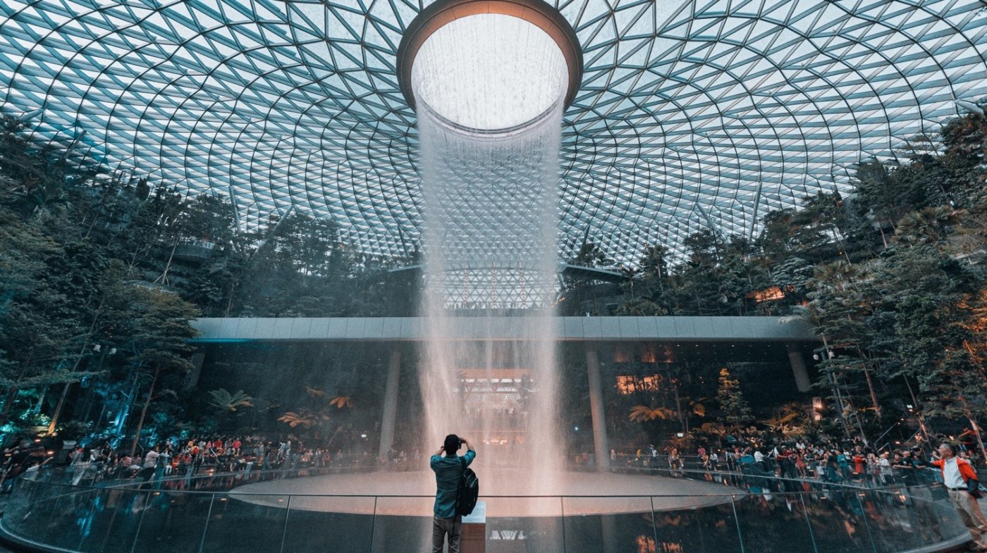 Jewel at Changi. A waterfall at the centre of a light-filled dome, in place of the corridors and carousels an airport terminal usually opens with.