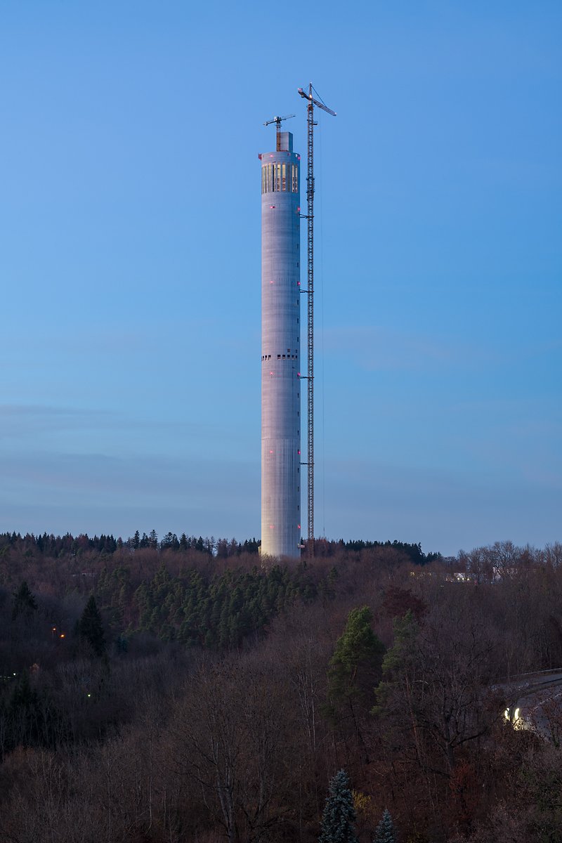A core and nothing else. Every one of its 246 metres is shaft with no rooms in it, clad in a Teflon-based PTFE textile that has to be prestressed, Alkan explained, or the wind makes it flutter.