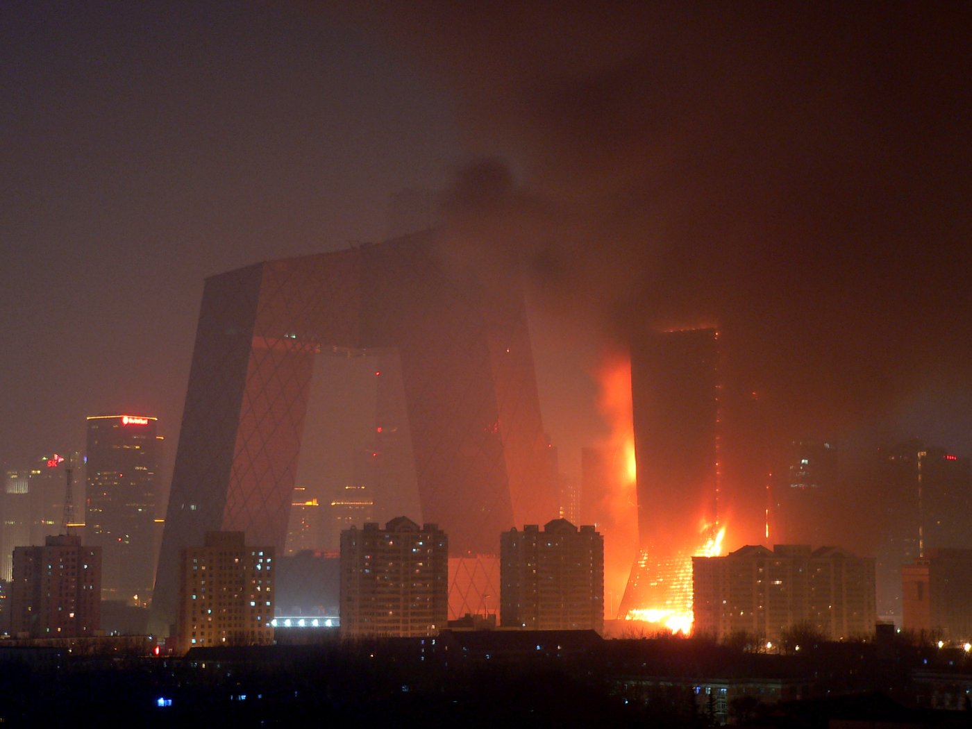 CCTV, Beijing, 2009. The tower caught fire from Chinese New Year fireworks, the first of the incidents Bhasin used to show the facade as the visible part of the failure.