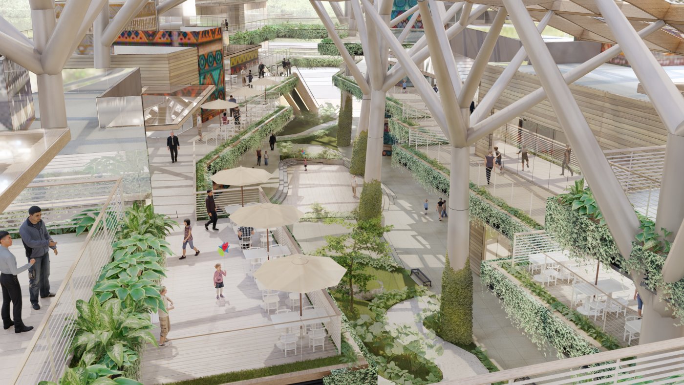 The part that earns nothing. The atrium is naturally lit and ventilated, and was kept as a third space where the community can sit without spending money.