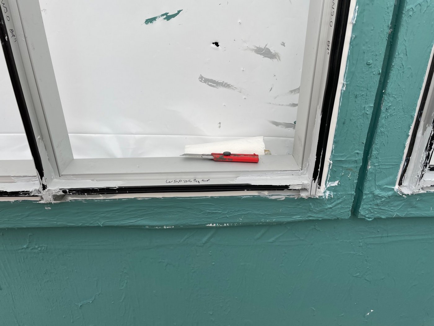 Wrapped, and holding the water in. Mittelstet said the shrink-wrap temporary protection fitted inside the window openings let the curtain wall go on without losing weather protection, but rain before the frames were glazed was trapped behind the sill.