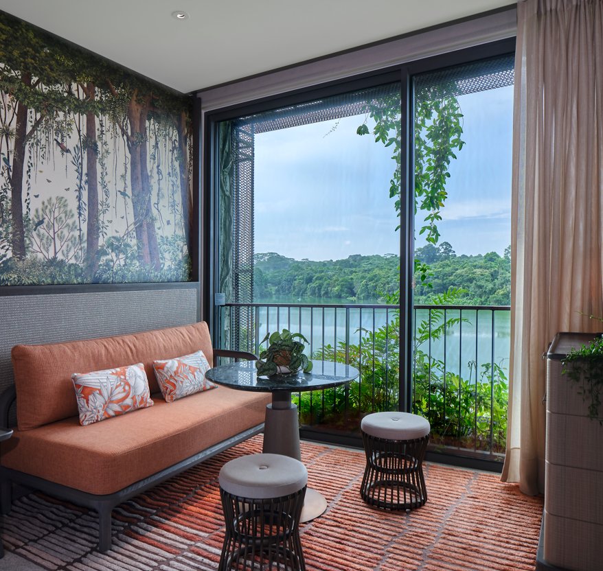 Hotel guest room with a fully openable façade onto a forest view