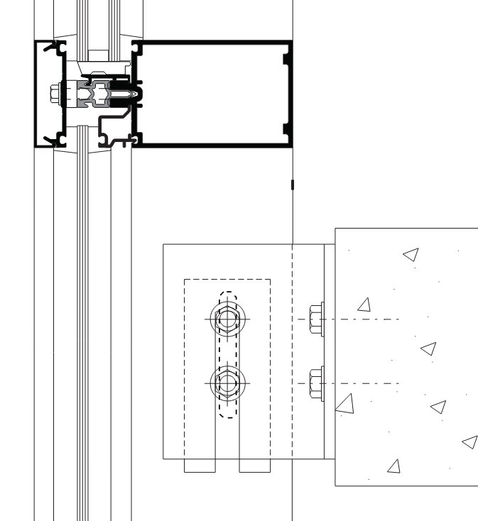 The three anchors. On unitised curtain wall the top anchor carries the gravity load, the stack joint at mid-height takes wind and allows vertical movement, and the lifting lug is only for putting the panel in place.