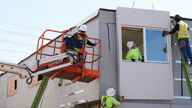 Retrofitting an occupied building. On a pair of Californian blocks over seventy years old, modular prefabricated panels and added insulation delivered around 40 per cent energy savings without rebuilding.