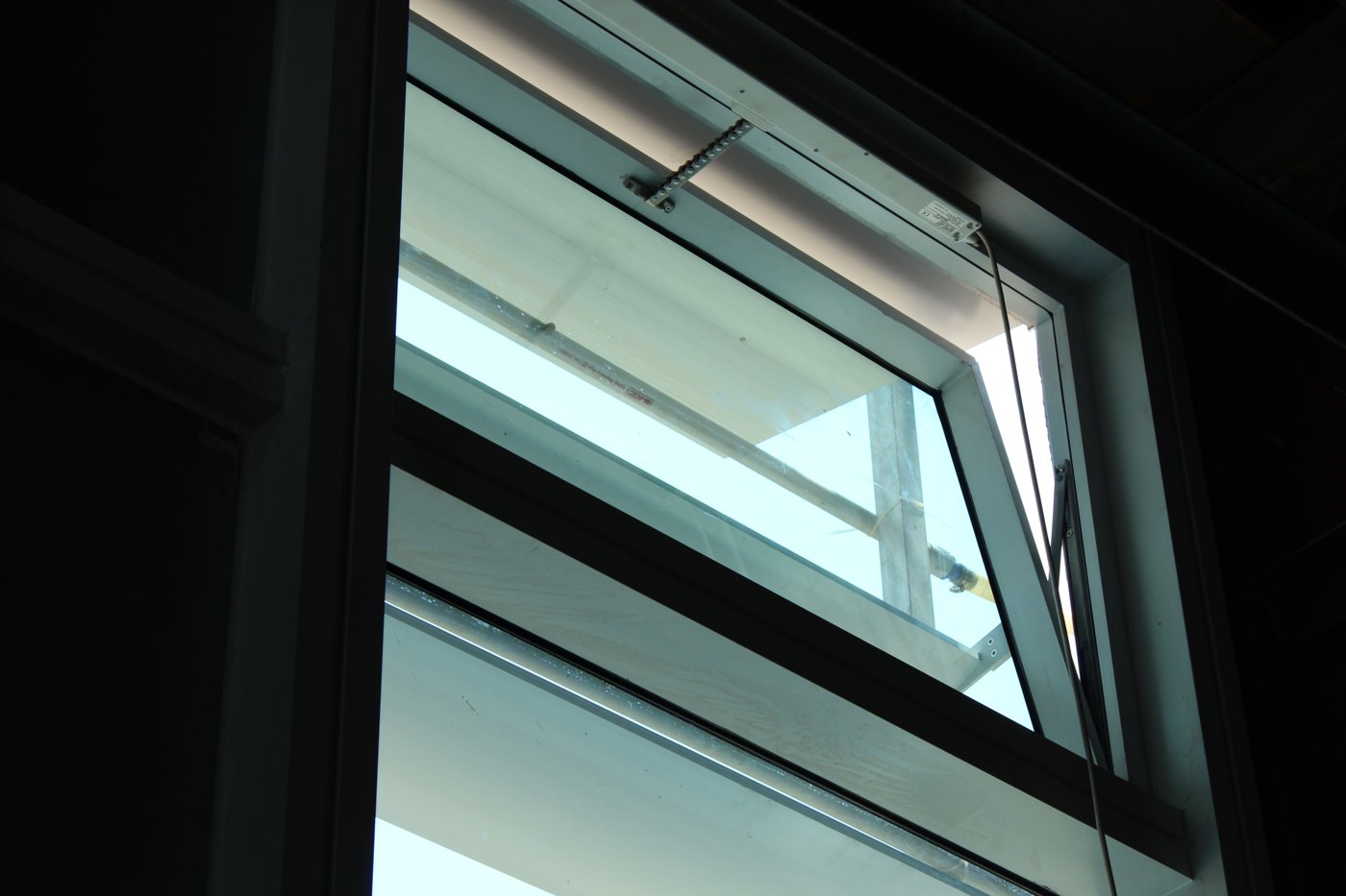 A side-hung openable panel in a glazed façade