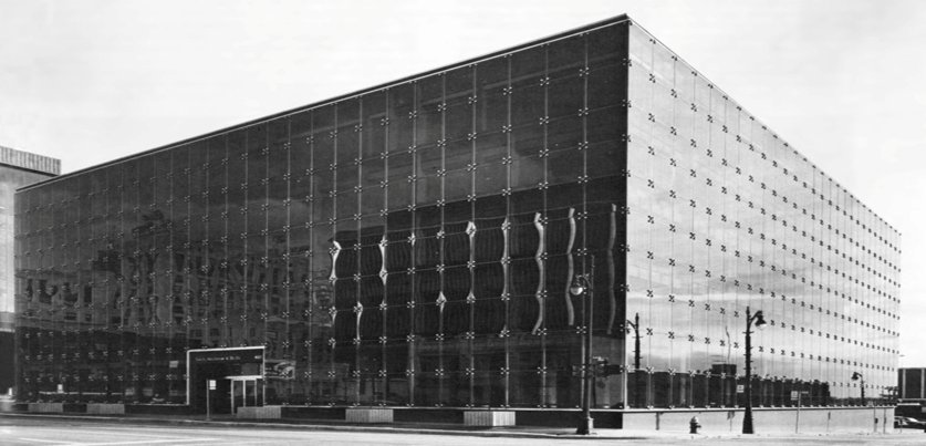 Detroit, 1971. The PPG building was the first project bonded with the company's structural sealant, and Subramanian cited it as a 54-year case history for silicone durability.