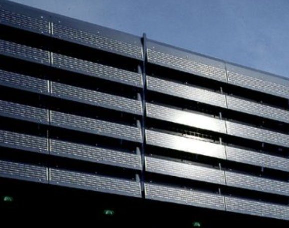 A dark, louvered façade