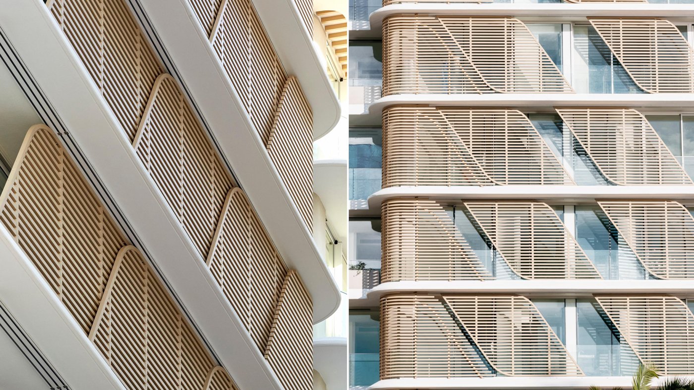 Balcony with diagonal operable aluminium screens and a coastal view