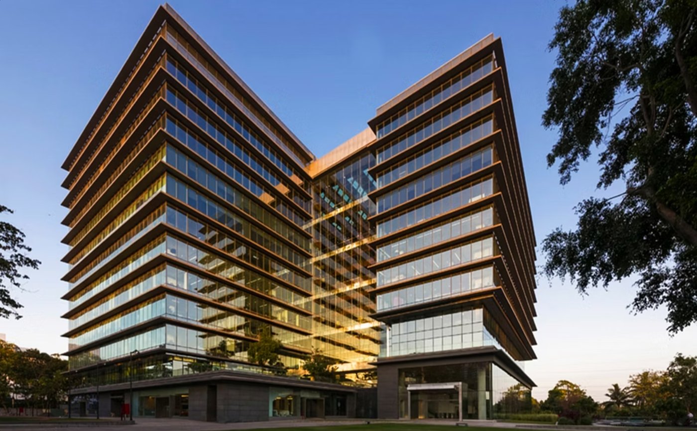 Office headquarters with projecting stone sun-shades over a unitised glass façade