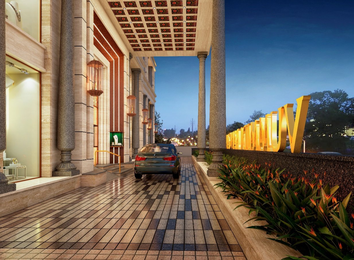 Warmly lit entrance portico and drop-off of the showroom