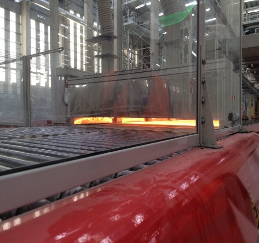 Above 2,000 degrees. In a long oven the minerals blend at a molecular level, Igartua said, so what comes out is a new stone rather than a mixture.