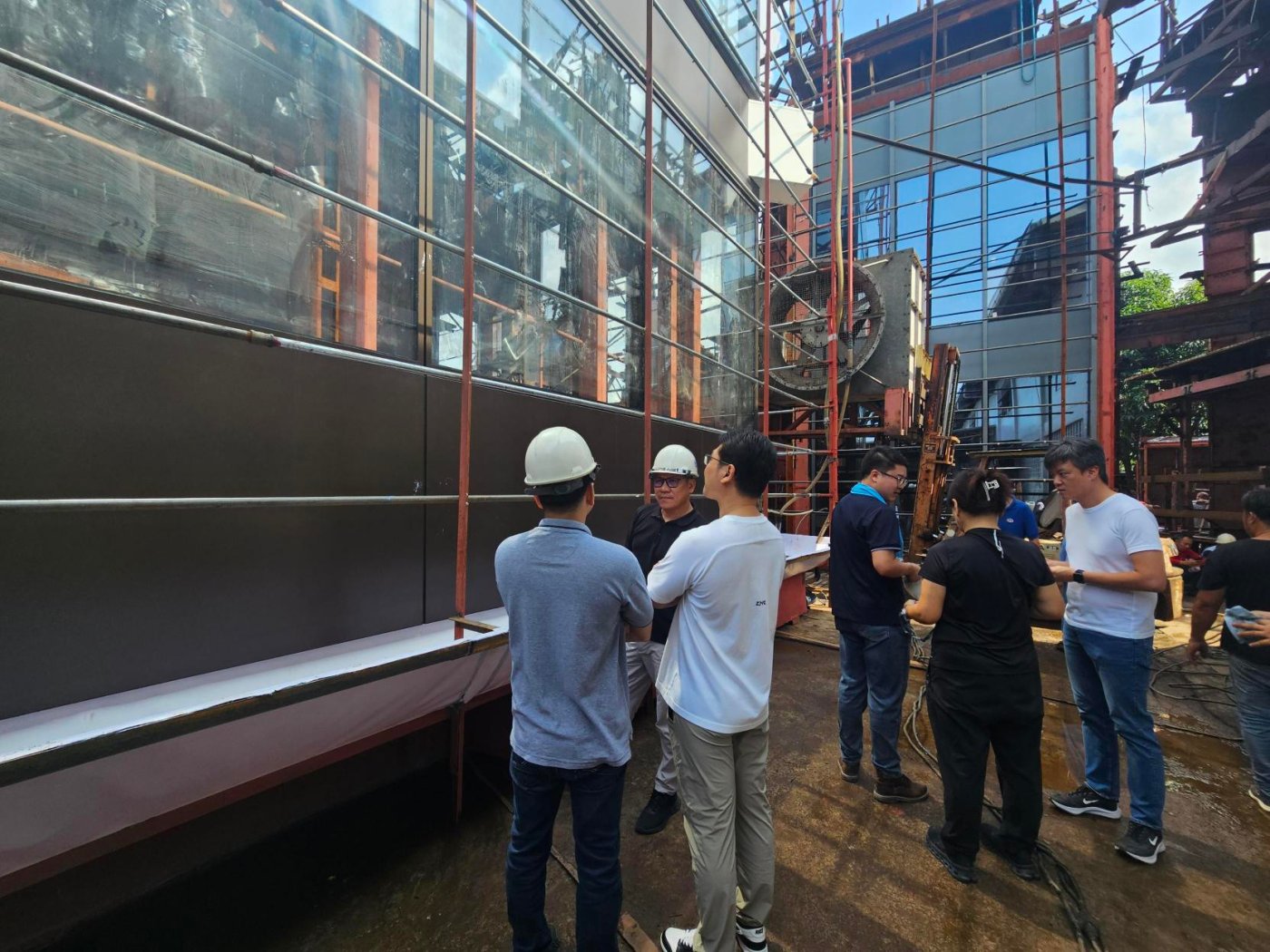 Before the rig is loaded. Materials are checked against the approved submittals and the installation sequence documented, so the specimen matches what will be built.