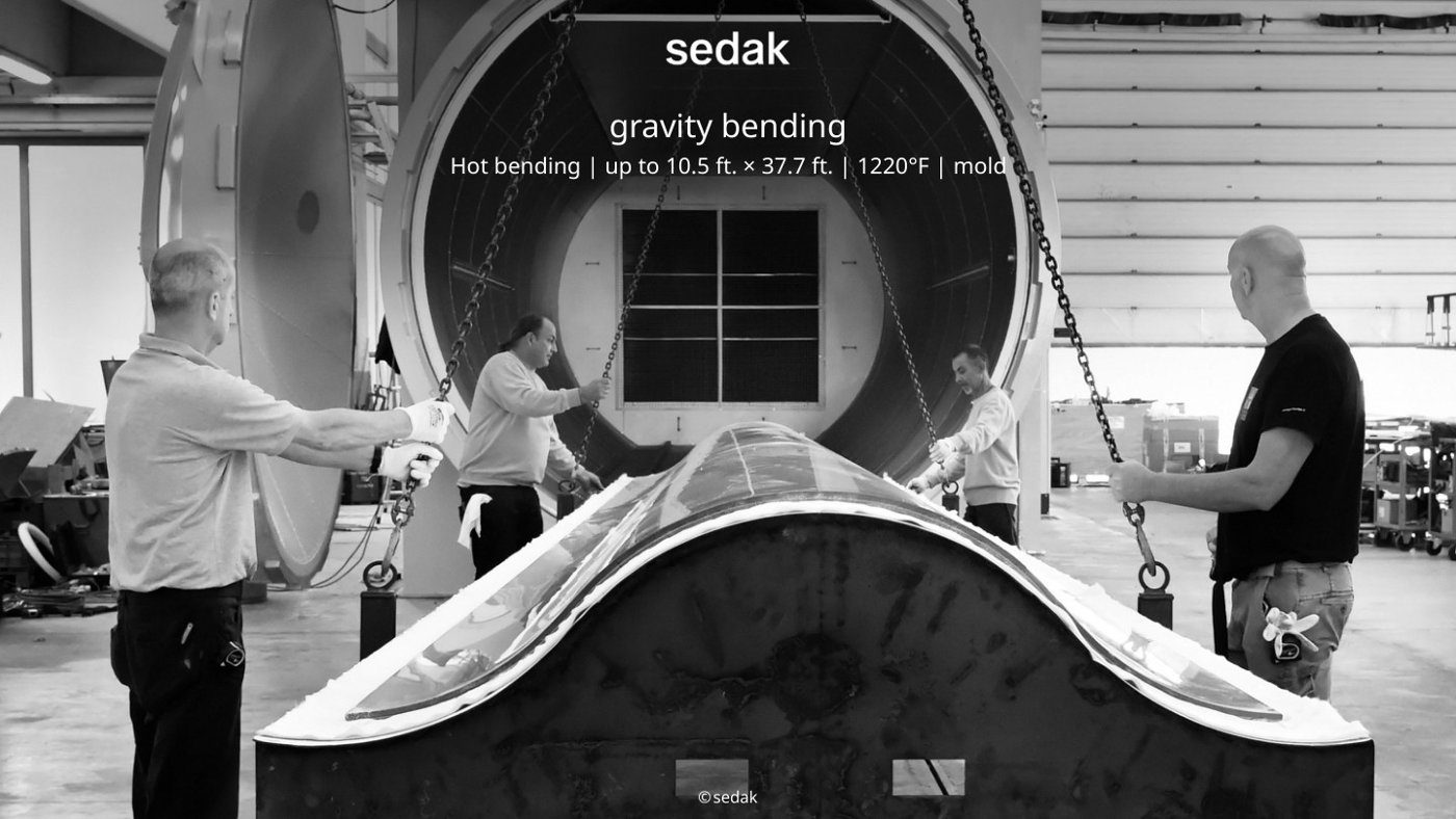 Gravity bending glass over a shaped mould