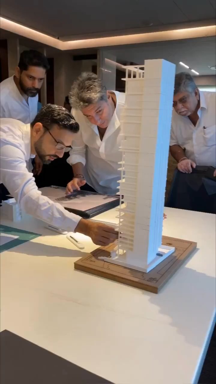 Floor by floor. Each level was 3D printed separately and the tower assembled by hand, allowing terrace positions and voids to be adjusted as the design progressed.