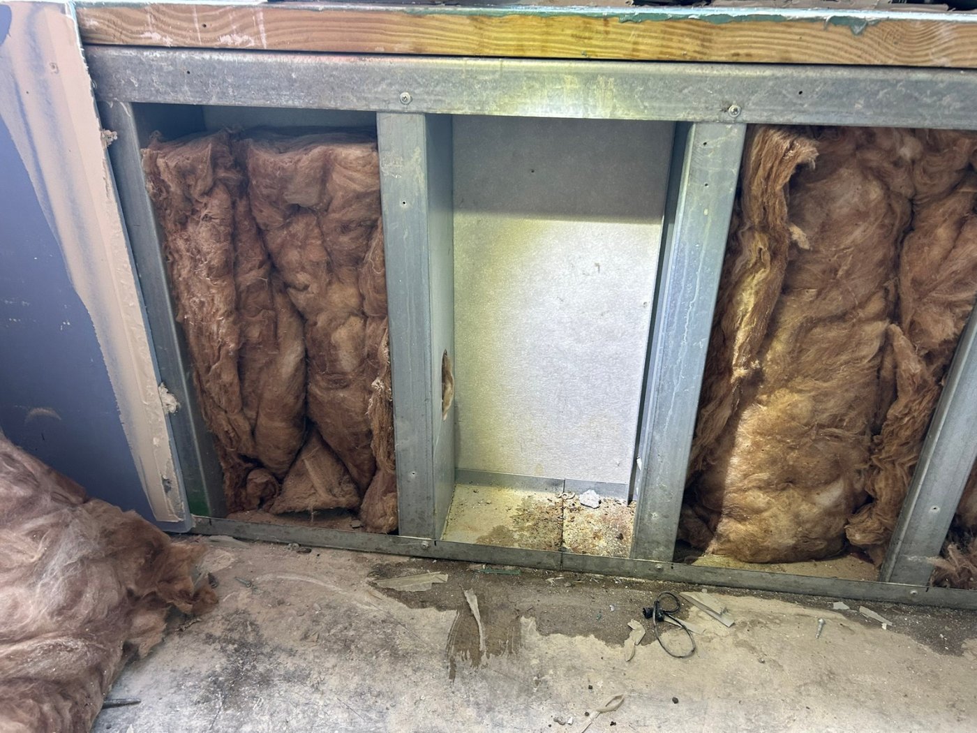 Next to the specimen, not in it. Mittelstet wanted a specification to count water found adjacent to or below the test area as a failure, because a contractor charged for retesting will otherwise argue the specimen itself passed.
